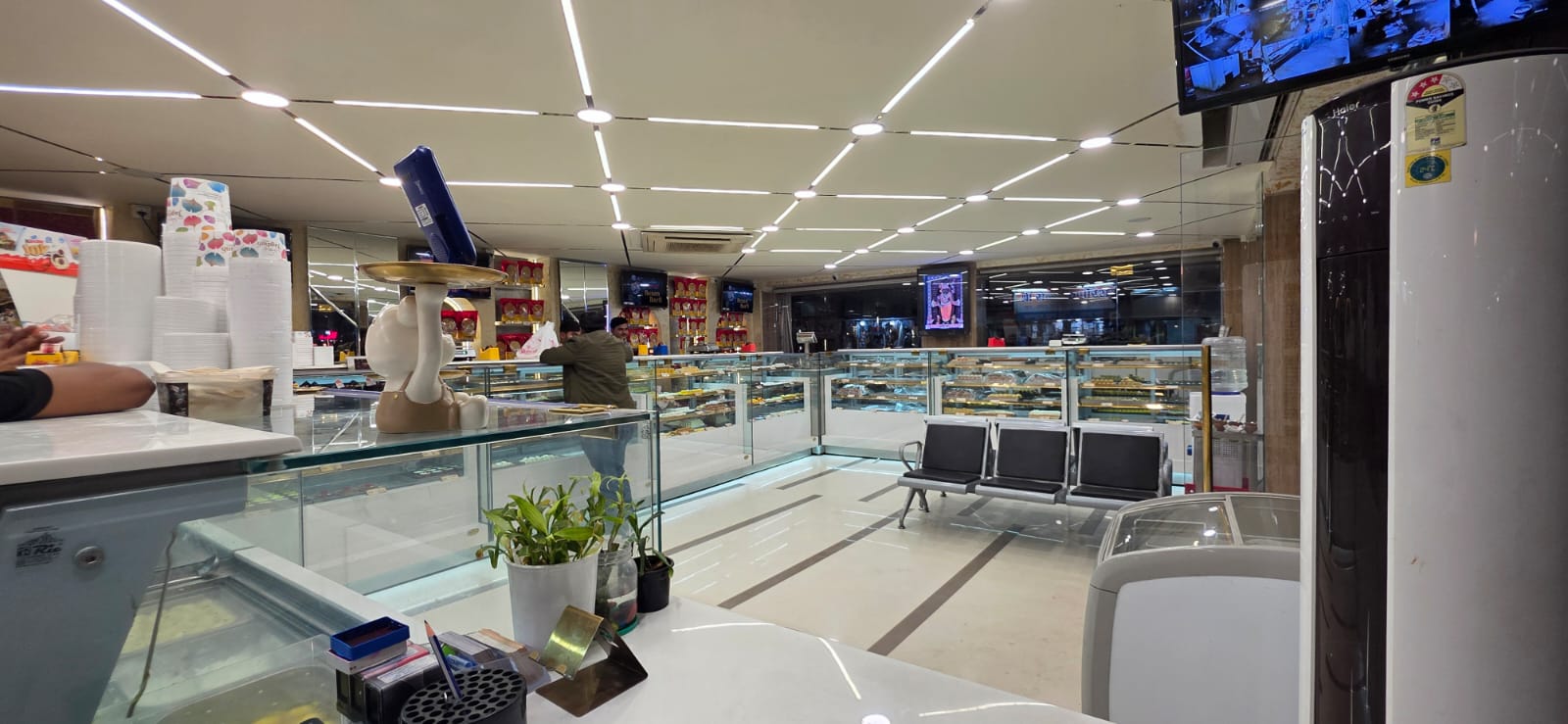 Inside Jagdish Sweets — sweet counters